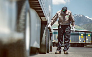 Man Checking Tires on a Truck