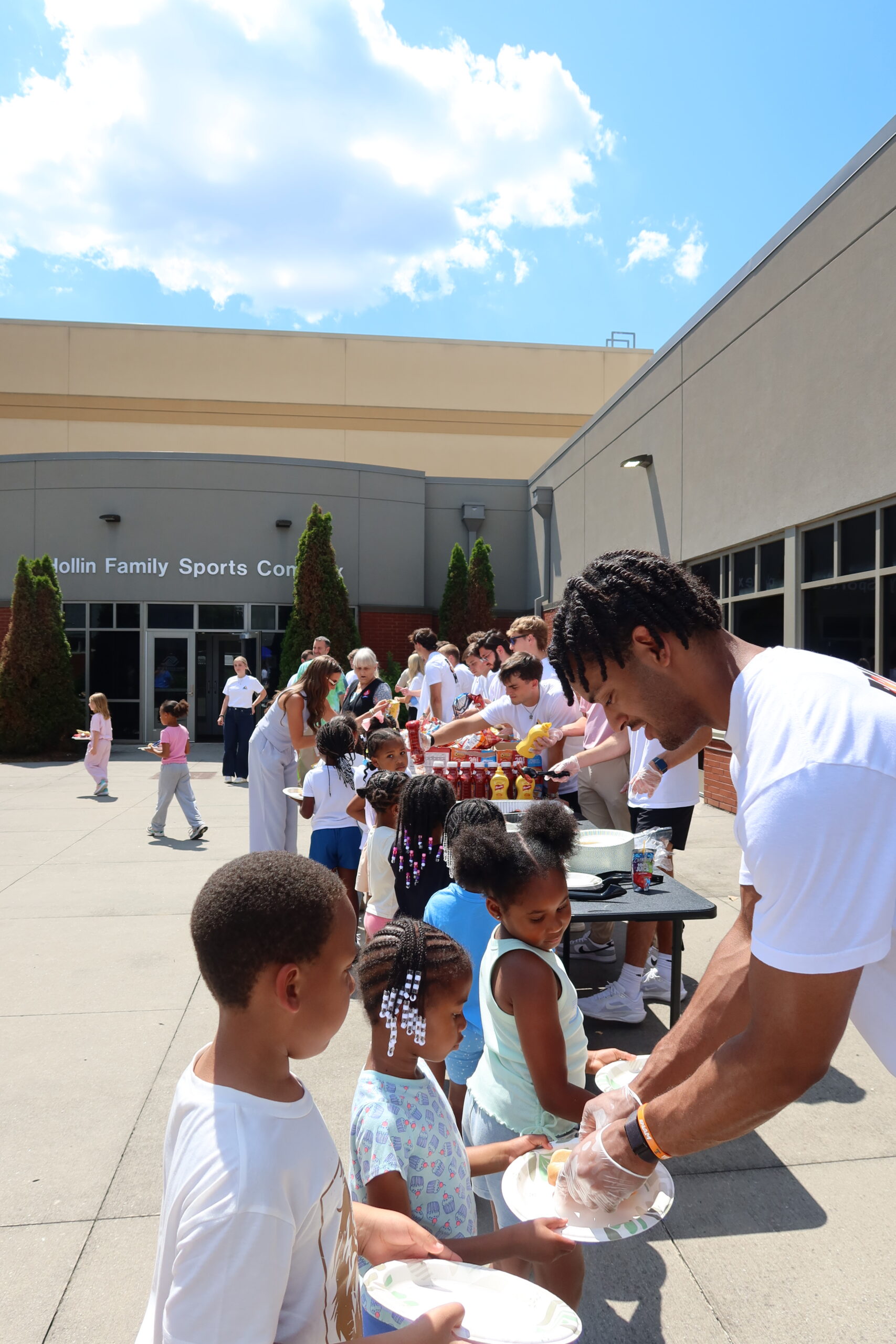 Axle Logistics volunteers serving lunch at the Boys & Girls Clubs of the Tennessee Valley Summer Kickoff Party through Axle Impact